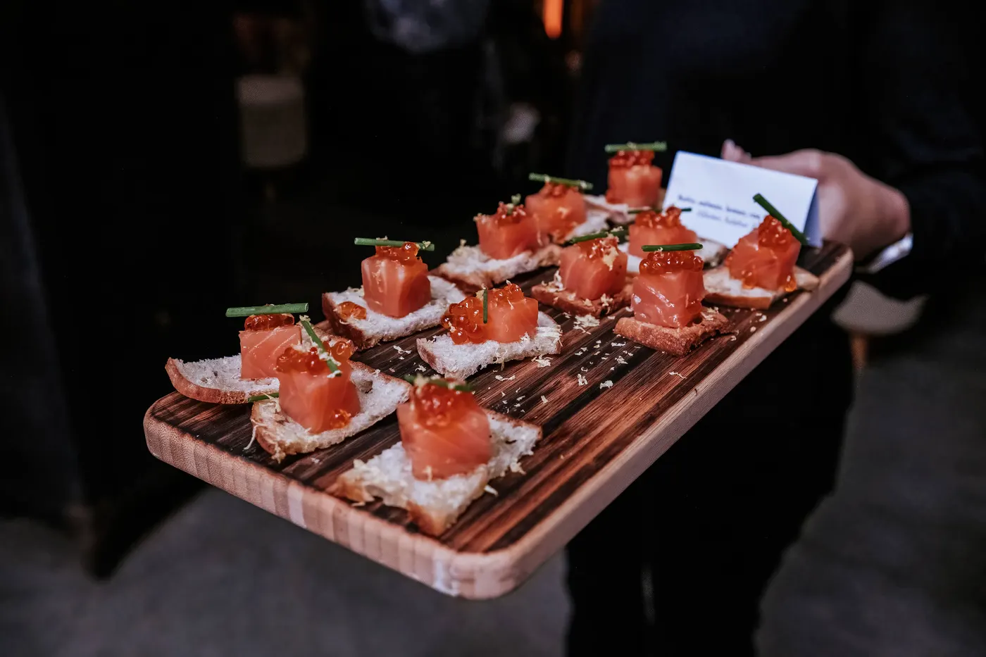 Canapes served on a wooden board by The Hackney kitchen