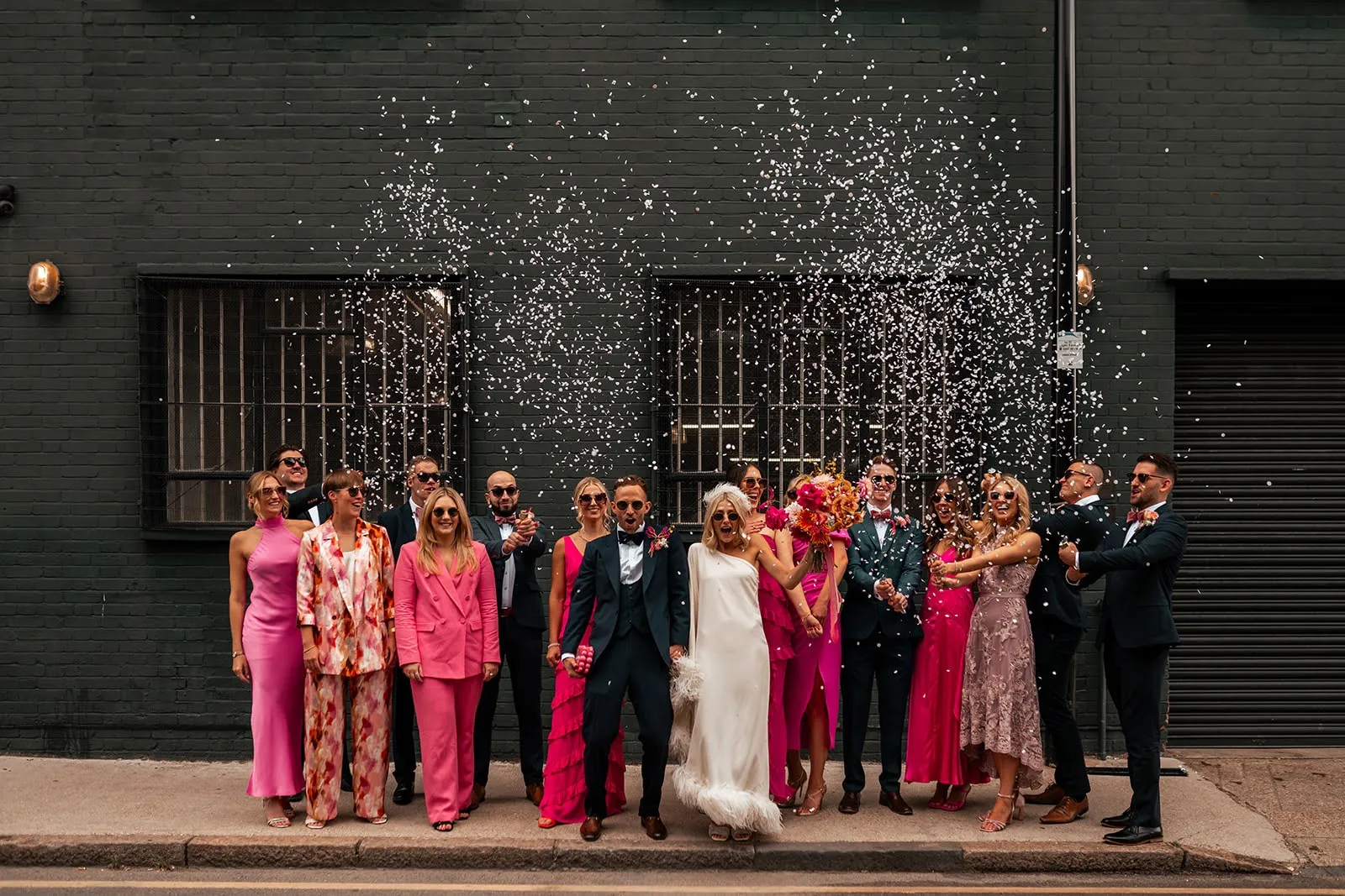 Confetti moment on Hackney Road as the wedding party arrives at The Hackney