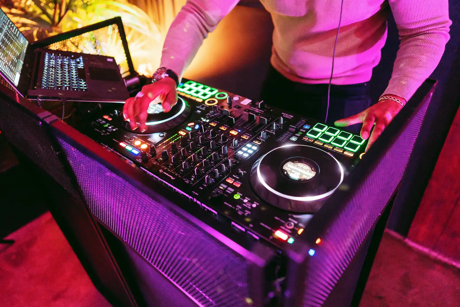 A DJ mixing on the Pioneer XDJ-RX3 decks at a wedding at The Hackney